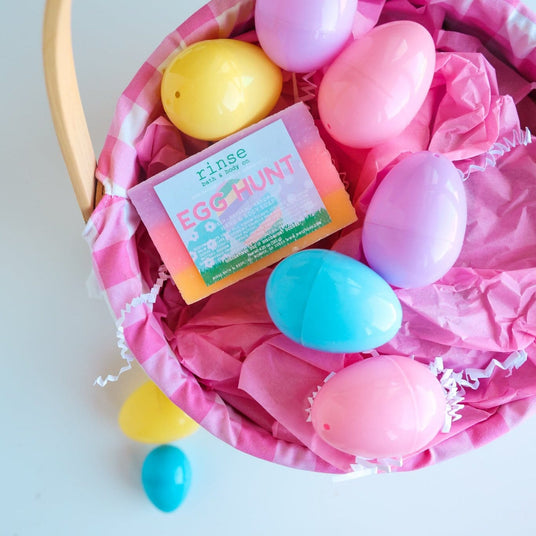 Easter lifestyle — dyed eggs in pink basket close-up. Text-free, bundle/card-ready.