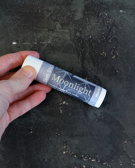 Moonlight solid lotion stick — orange blossom, patchouli and musk in a twist-up bar. Rinse Bath & Body Co.