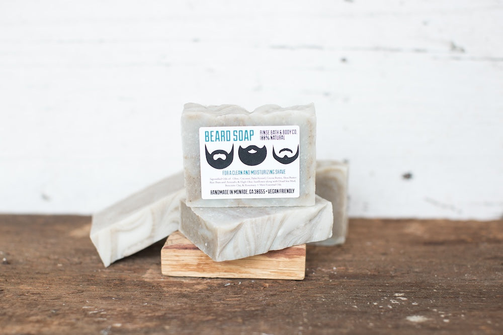 4 Rinse beard soaps on wooden table with white background