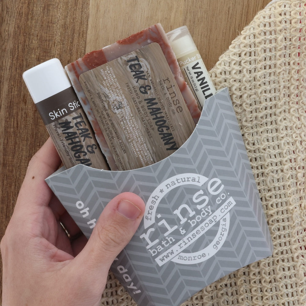 Teak and Mahogany gift pack in grey chevron fry-bag with soap, skin stick, and vanilla pucker stick