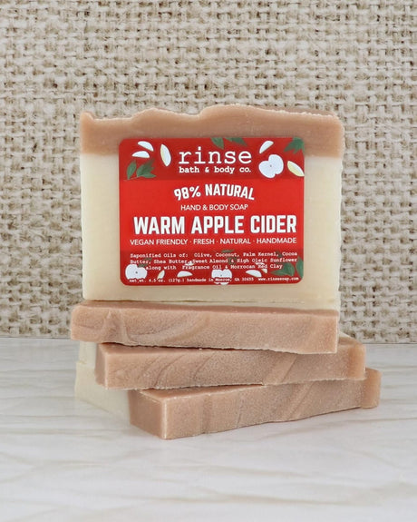 Warm Apple Cider mini soap close up, showing the poured amber layers through the bar. Rinse Bath & Body Co.