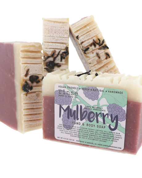Mulberry bar soap with its deep berry swirl and botanical label — dark ripe fruit over a cocoa-butter base. Rinse Bath & Body Co.