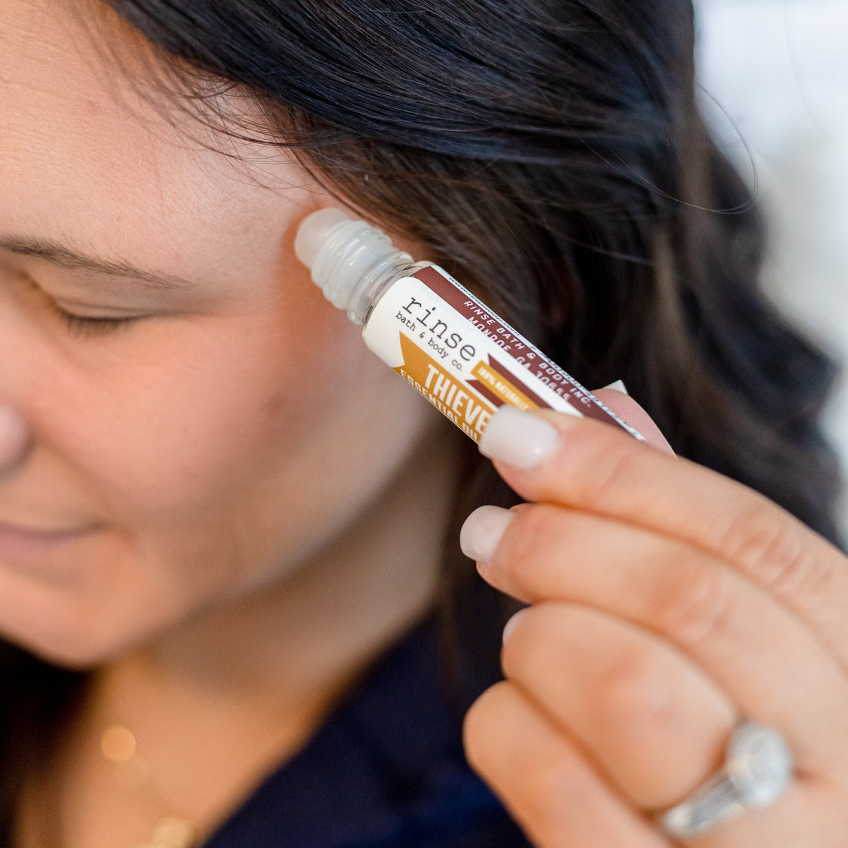 Rinse Thievery essential oil roll-on - targeted aromatherapy - lifestyle shot