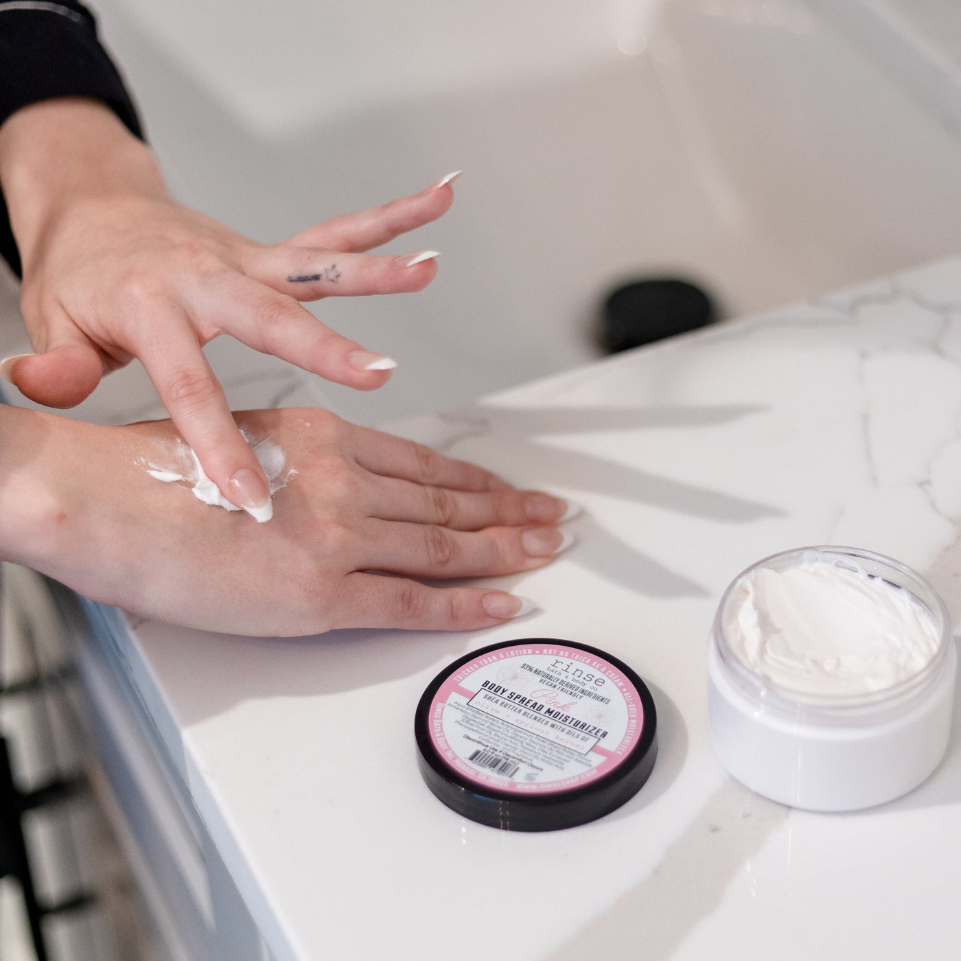 Pink natural body lotion from Rinse - shea butter enriched - alternate angle