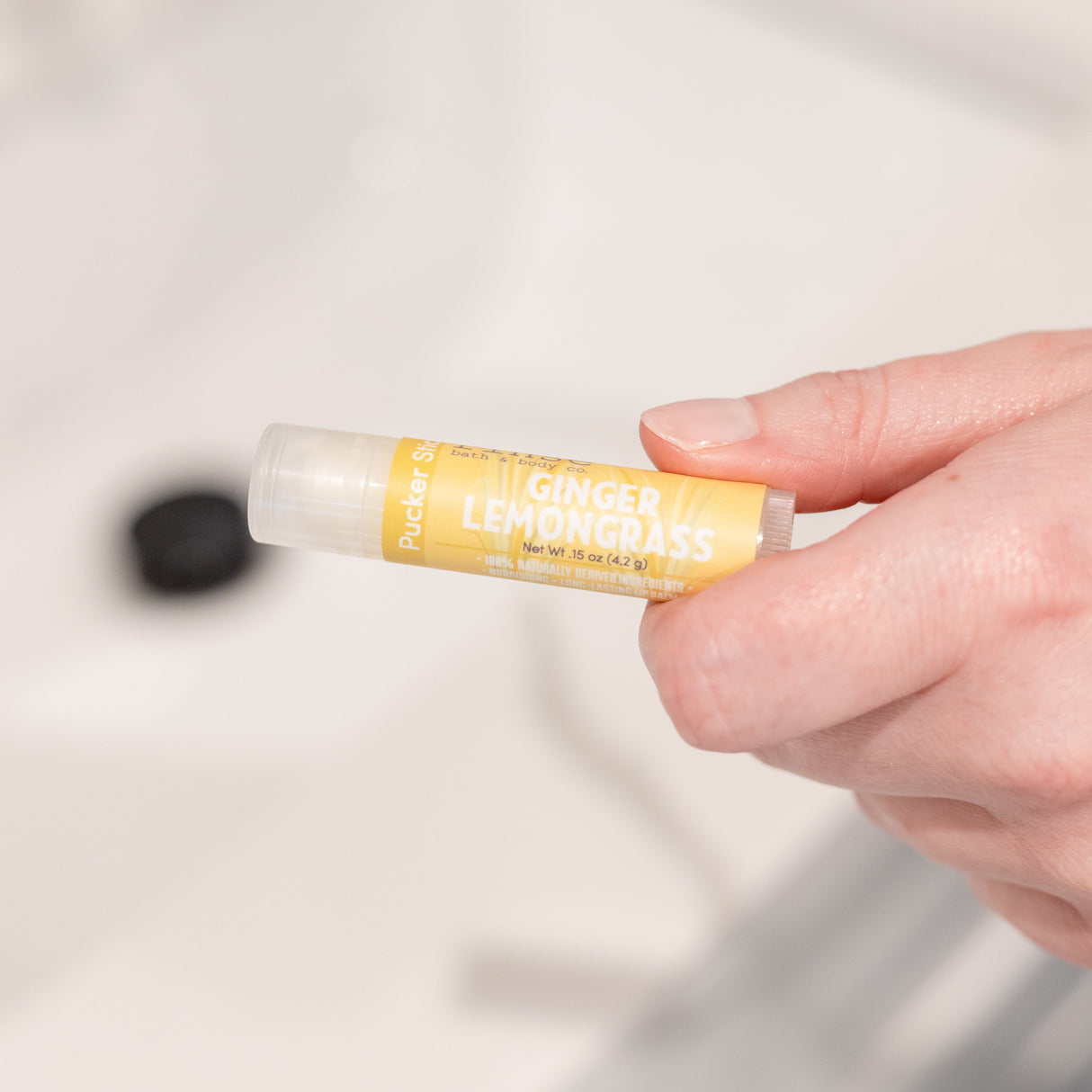 natural lip balm in Ginger Lemongrass by Rinse Bath & Body - detail view