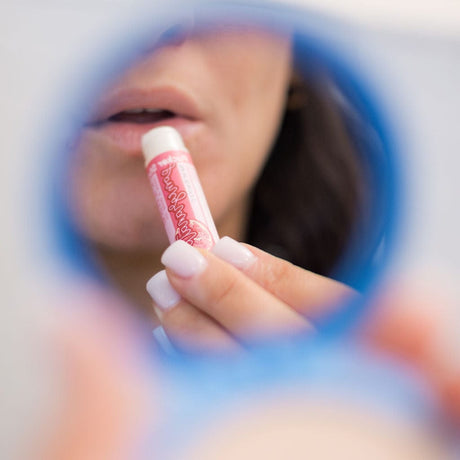 Pomegranate natural lip balm from Rinse - nourishing lip care - lifestyle shot