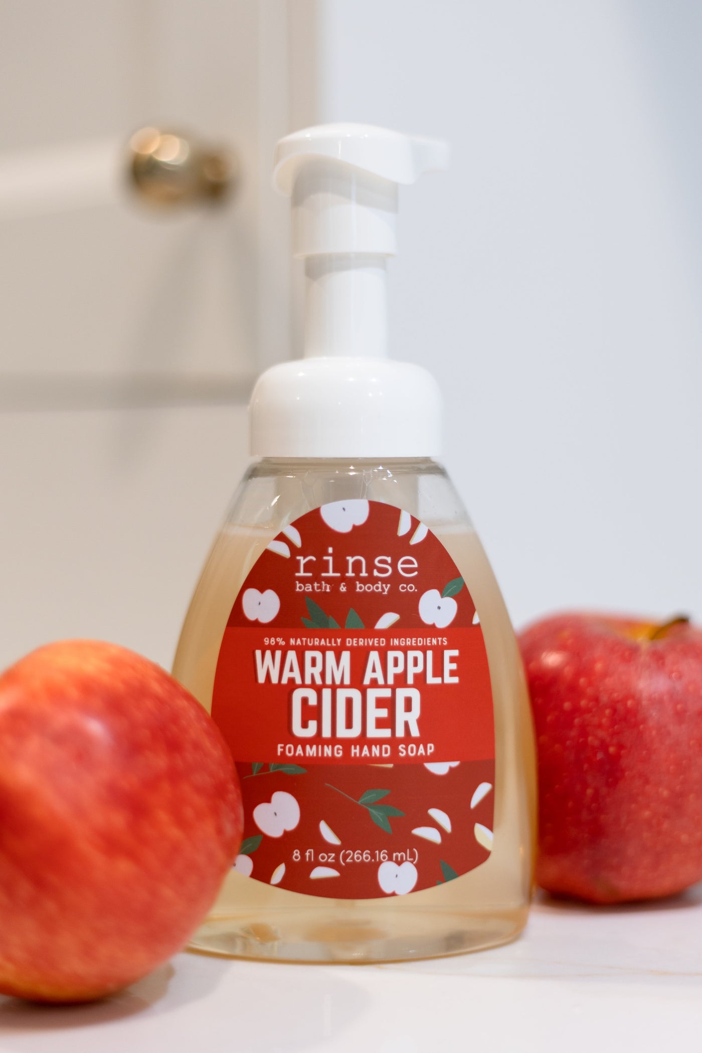 Warm Apple Cider Foaming Hand Soap styled styled with apples — Rinse Bath & Body Co.