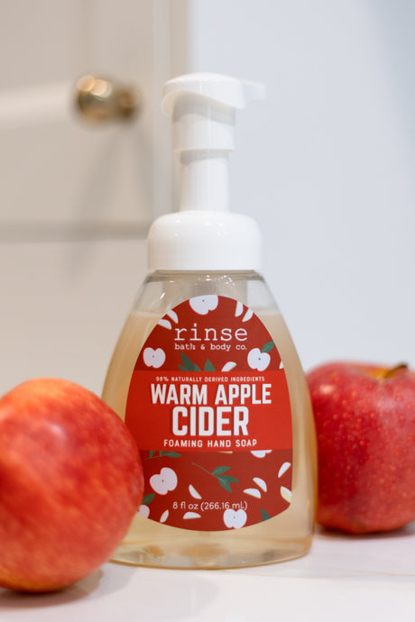 Warm Apple Cider Foaming Hand Soap styled styled with apples — Rinse Bath & Body Co.