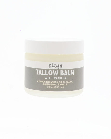 A small white plastic jar of Rinse Tallow Balm with Vanilla on a solid white background.