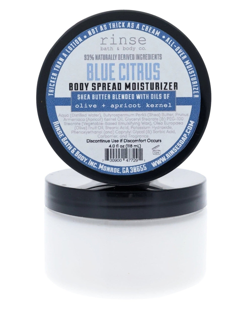 Blue Citrus Body Spread jars stacked on white — black lids and shea-butter label in bright studio light