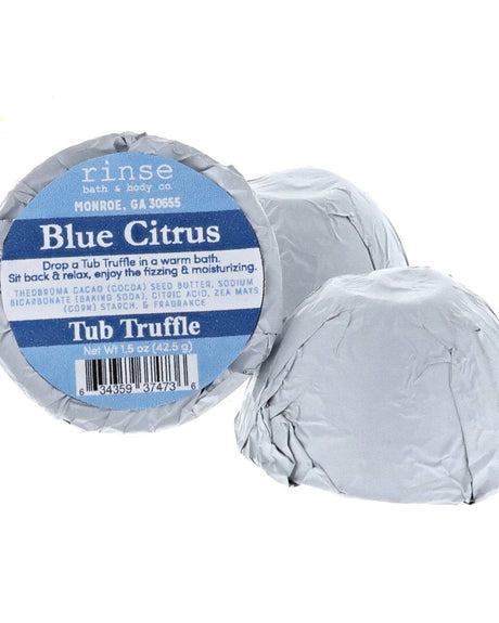 Three foil-wrapped Blue Citrus Tub Truffles standing on bright white — circular blue label in clean studio light