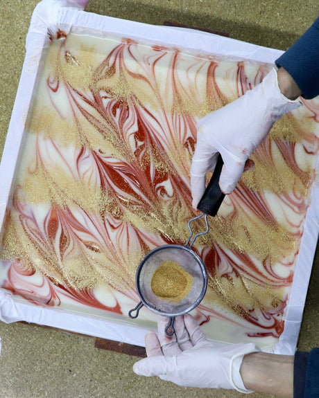 Cabernet Sauvignon bars stacked to show the marbled wine-red pour through each one. Rinse Bath & Body Co.