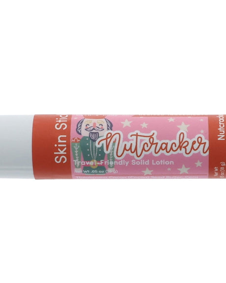 Nutcracker Skin Stick stylized twist-up solid lotion — pink glitter label in clean light