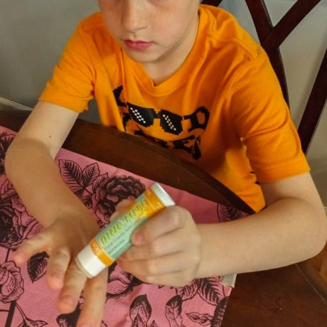 Dino Mite solid lotion stick from Rinse - concentrated moisture bar - lifestyle shot