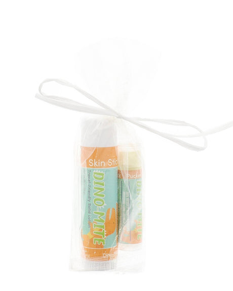 Dino-Mite Skin Stick and Pucker Stick tied in a sheer gift bag with a white raffia ribbon bow