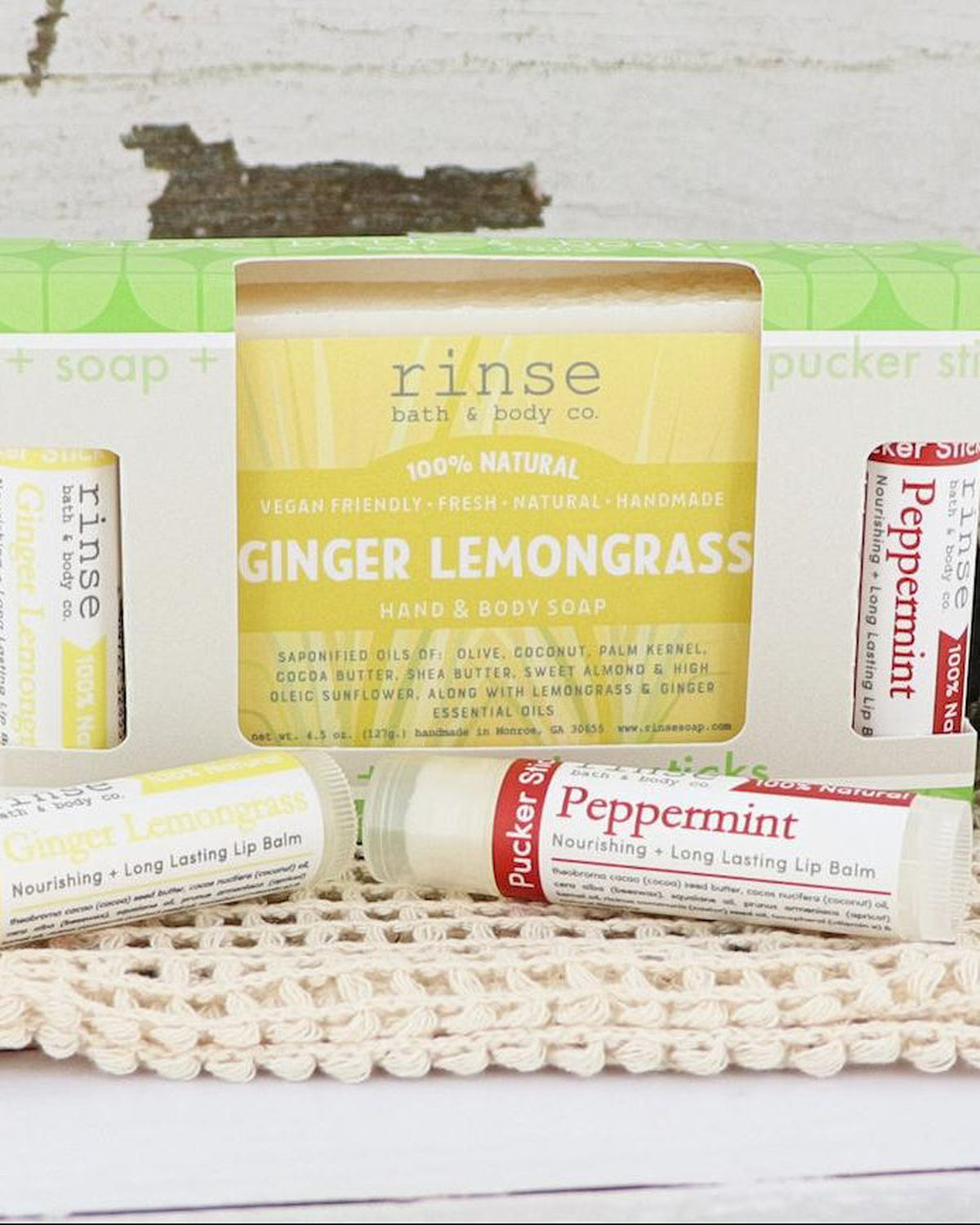 Ginger Lemongrass soap with Ginger Lemongrass and Peppermint Pucker Sticks in a scalloped green window gift box on crocheted cloth