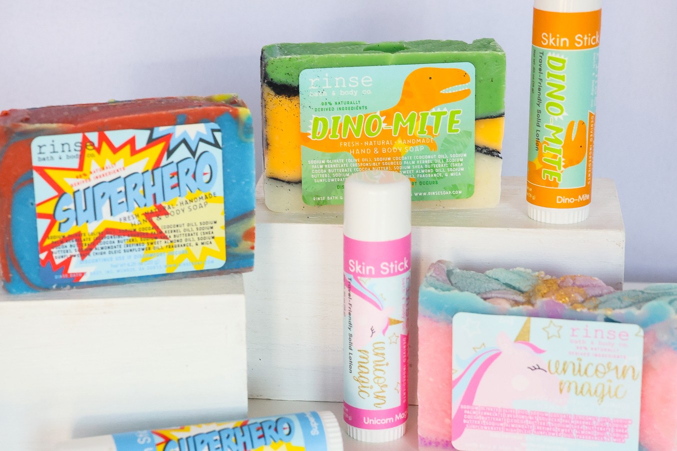 Colorful Rinse kids soaps, skin sticks and pucker sticks flat lay