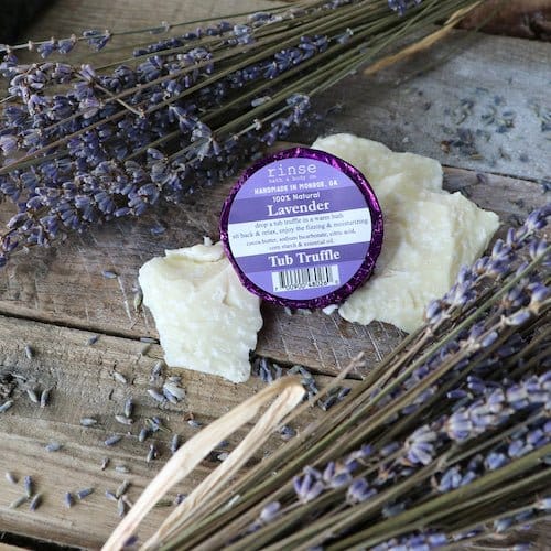 A single Lavender Tub Truffle in purple foil, cocoa butter bath melt. Rinse Bath & Body Co.