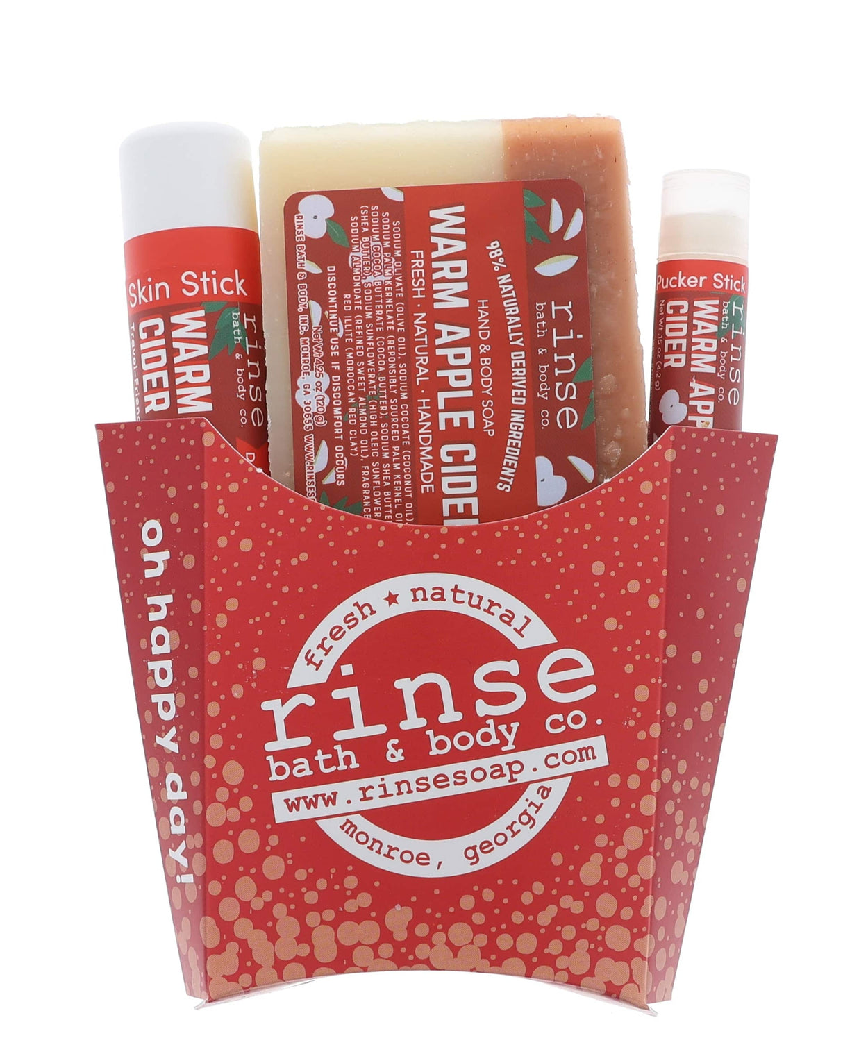 The Warm Apple Cider fry-box gift set open to show its pieces in a kraft fry carton — spiced apple, clove and brown sugar, ready to hand over. Rinse Bath & Body Co.