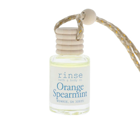Small bottle of 'Orange Spearmint' perfume with a rope on a white background