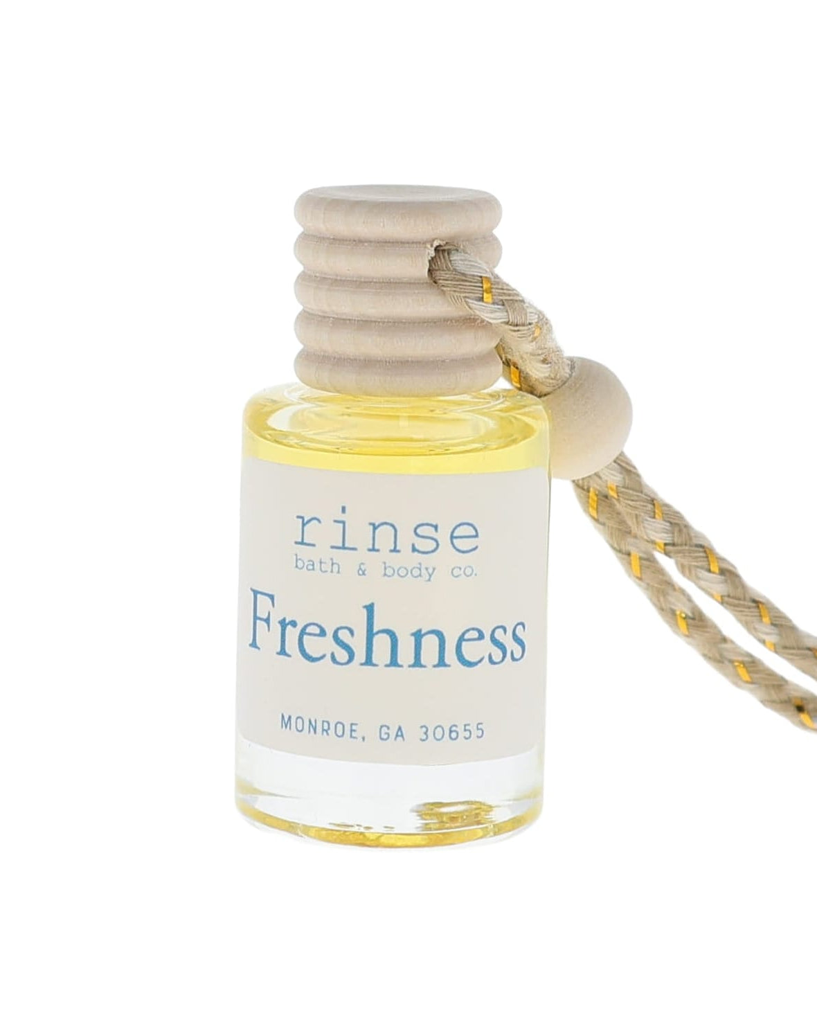 Small bottle labeled 'Freshness' with a string on a white background
