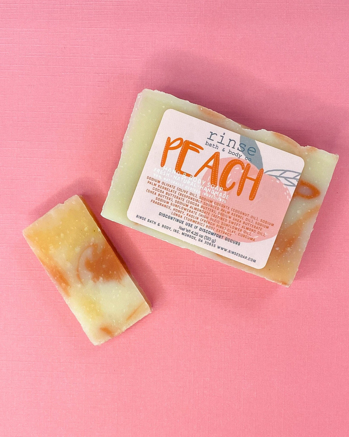 Full Peach bar and thin slice on textured pink — cream orange marble under soft flat-lay light