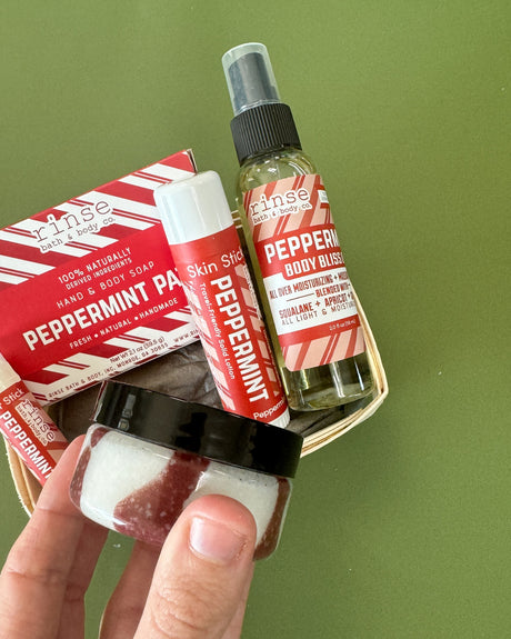 Peppermint Patti travel set on green — new candy-stripe labels in a wooden berry till, ready-to-gift