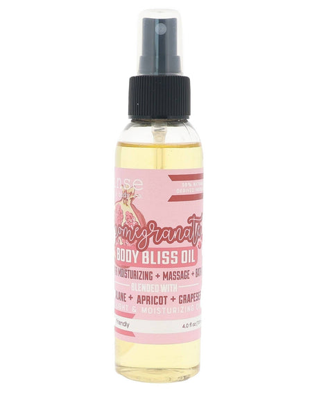 Pomegranate Body Bliss oil in its bottle with the pink harvest label — bright pomegranate over grapeseed and apricot kernel. Rinse Bath & Body Co.