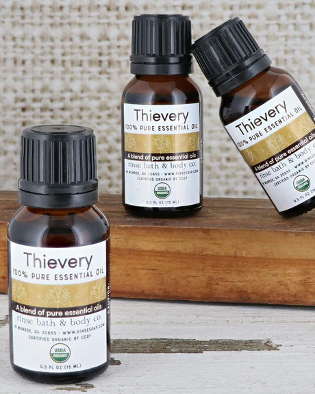 Thievery essential oil bottle showing its USDA organic seal — undiluted, for diffusers and your own blends. Rinse Bath & Body Co.