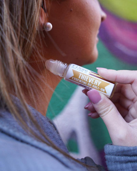 Thievery Essential Oil Roll-On in use — Rinse Bath & Body Co.