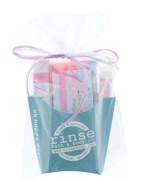 The Unicorn Magic gift set wrapped in cellophane and tied with a lilac ribbon bow — arrives gift-ready, no wrapping needed. Rinse Bath & Body Co.