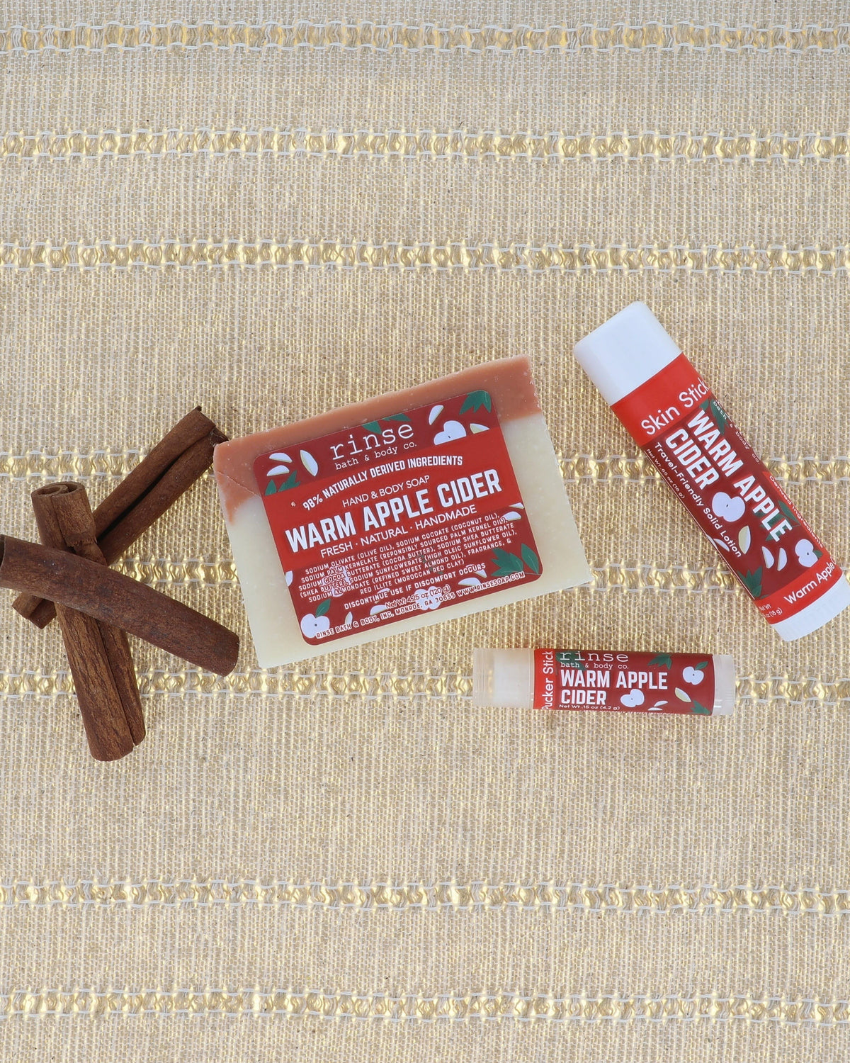 Warm Apple Cider bar soap stylized with whole apples and cinnamon on warm wood — spiced orchard lifestyle