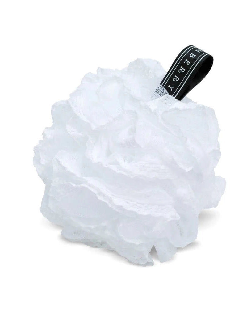White Finchberry lacy loofah with black hang ribbon — soft bath accessory.