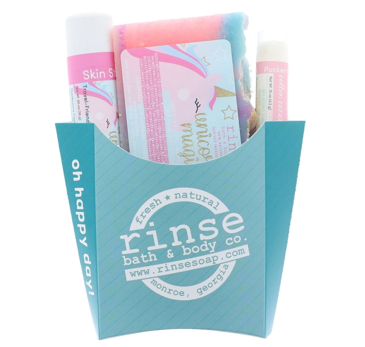 The Unicorn Magic kids gift set in its aqua carton — swirled unicorn bar soap, solid lotion skin stick and lip balm. Rinse Bath & Body Co.