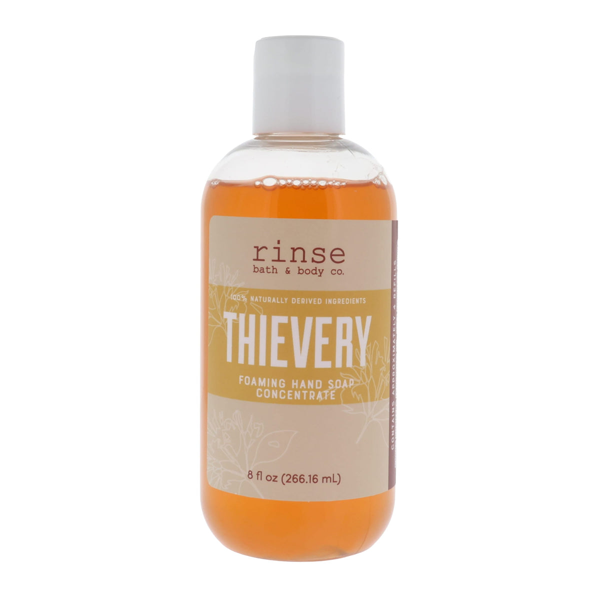 Thievery Foaming Hand Soap Concentrate standing on bright white — amber liquid and botanical tan label