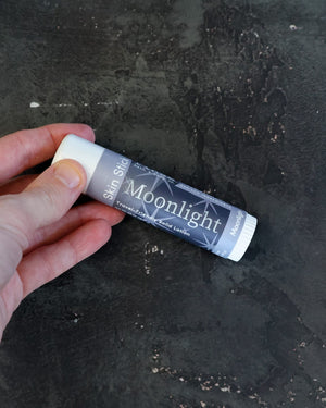 Moonlight solid lotion stick — orange blossom, patchouli and musk in a twist-up bar. Rinse Bath & Body Co.
