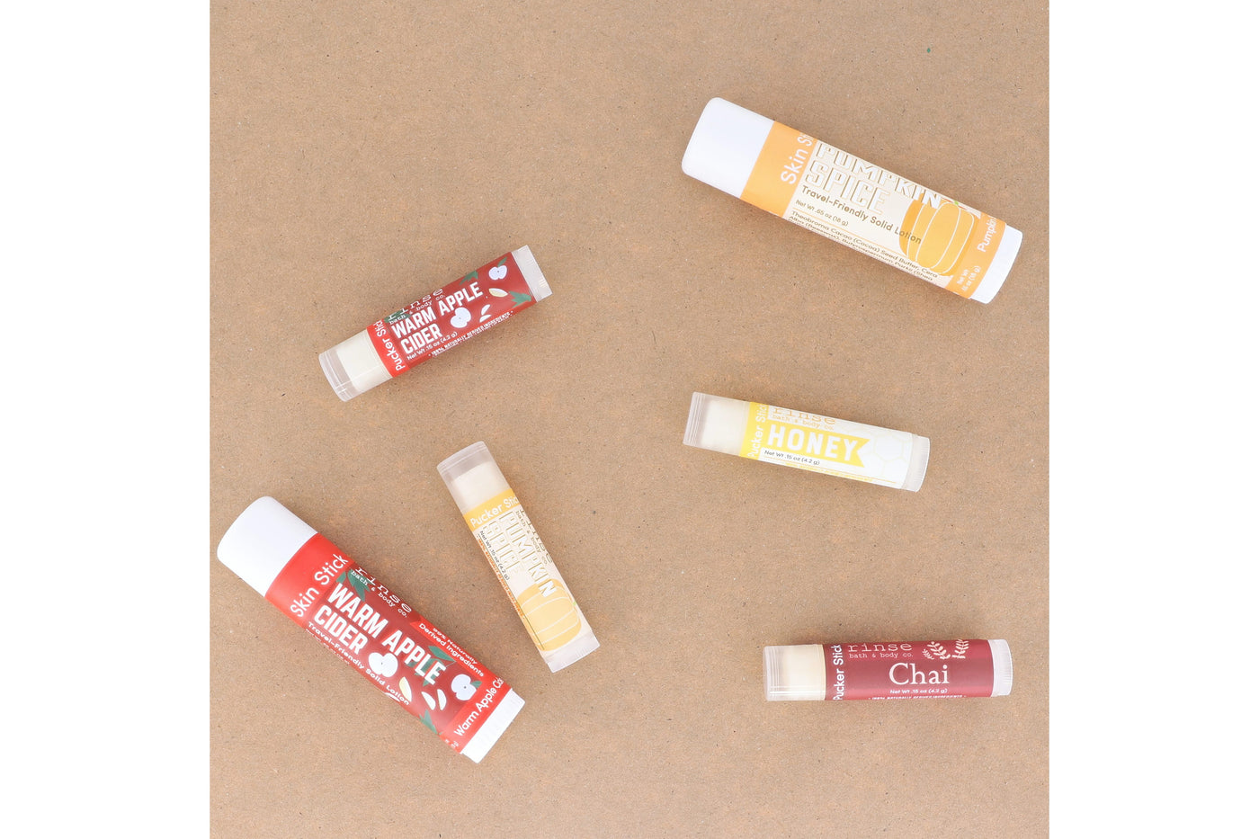 Warm Apple Cider Lip Balm styled with cider cue — Rinse Bath & Body Co.