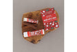 Two Warm Apple Cider solid lotion sticks resting on a live-edge walnut board beside their red harvest-print cartons — spiced apple, clove and brown sugar, made for the first cold morning of sweater weather. Rinse Bath & Body Co.