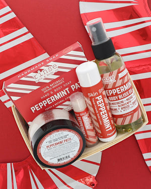 Peppermint Patti travel gift set packed in a berry till on red and white candy-stripe foil, labels facing up