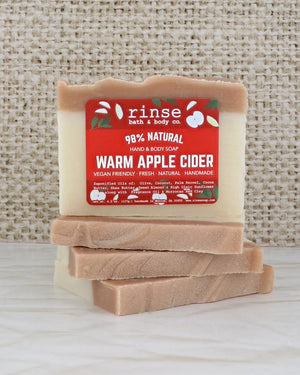 Warm Apple Cider mini soap close up, showing the poured amber layers through the bar. Rinse Bath & Body Co.