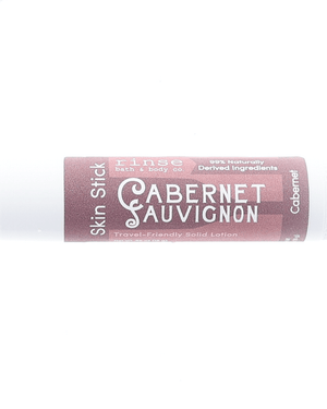 Cabernet Skin Stick — travel-friendly solid lotion in a twist-up tube. Rinse Bath & Body Co.