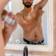 Applying a Rinse aluminum-free DeOdor Stick — natural deodorant in use