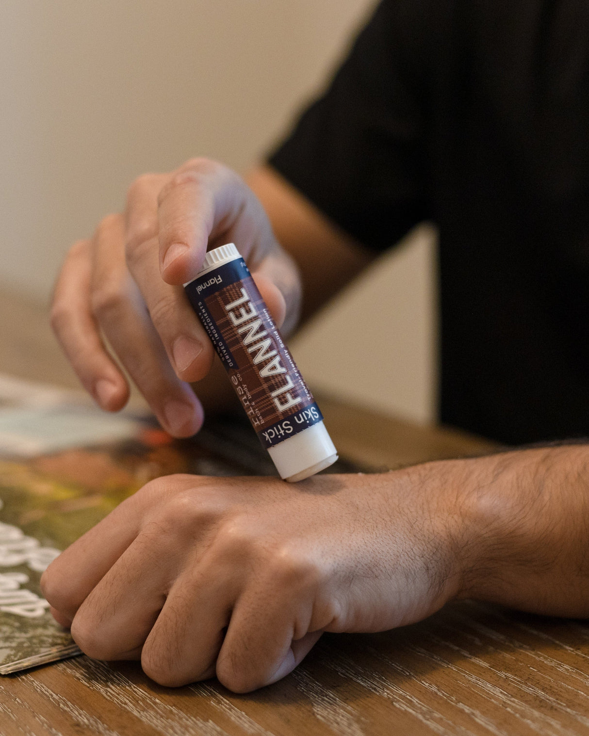 Flannel solid lotion stick smoothed onto skin — sharp musk and clean cotton in a twist-up bar built for hands that work. Rinse Bath & Body Co.