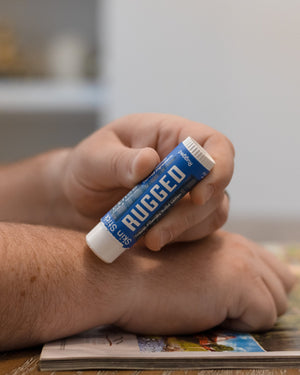 Rugged solid lotion stick — warm woodsy scent in a twist-up bar built for hands that work. Rinse Bath & Body Co.