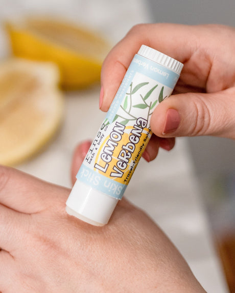 Lemon Verbena solid lotion stick — bright citrus in a twist-up bar of concentrated moisture. Rinse Bath & Body Co.