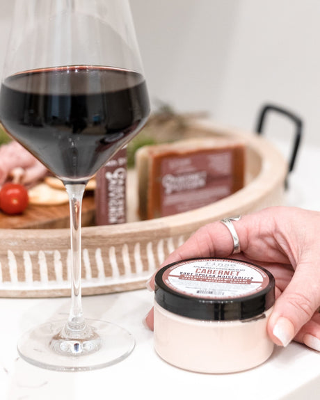 Cabernet body spread in its tub with the lid off, showing the whipped butter inside. Rinse Bath & Body Co.