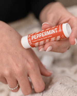 Peppermint solid lotion stick — cooling peppermint in a twist-up bar for dry hands and feet. Rinse Bath & Body Co.