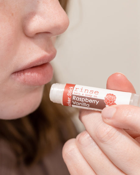 Raspberry Vanilla lip balm — a zing of raspberry balanced by warm vanilla. Rinse Bath & Body Co.