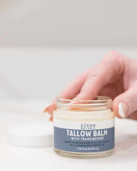 Frankincense grass-fed tallow balm in its glass jar — rendered tallow and frankincense essential oil, ancient ingredients for dry patches and cracked skin. Rinse Bath & Body Co.