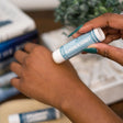 Almond & Honey Solid Lotion Skin Stick in use — Rinse Bath & Body Co.